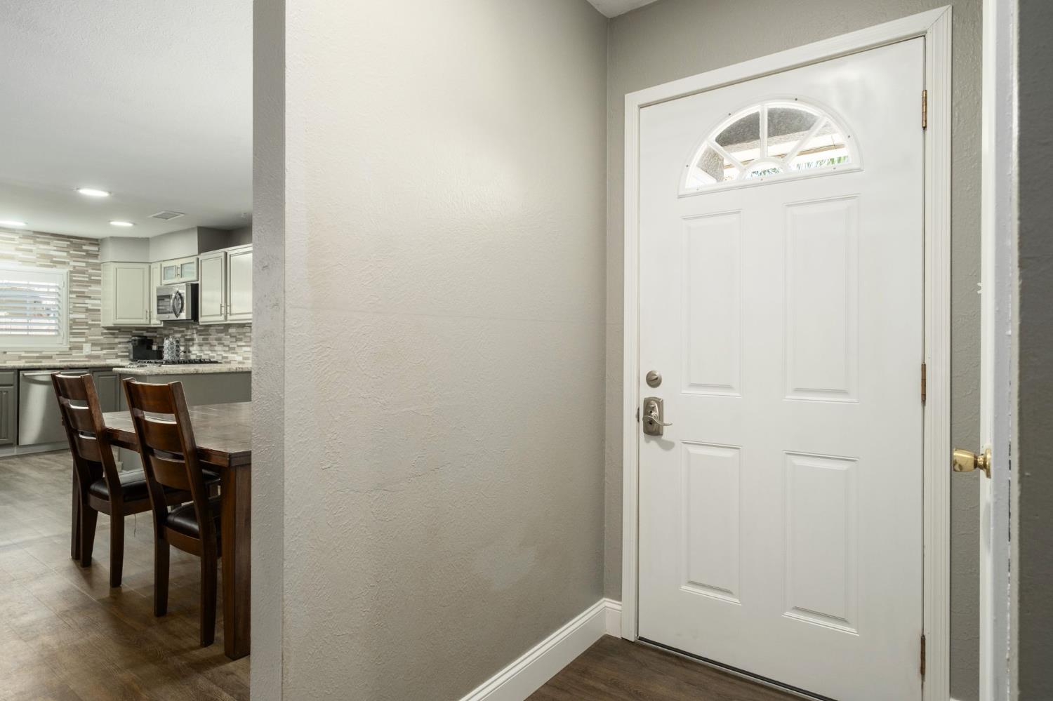 2604 Harvard Avenue Clovis, CA 93612 - Photo 5 of 28 a view of a hallway to a room with dining room and utility