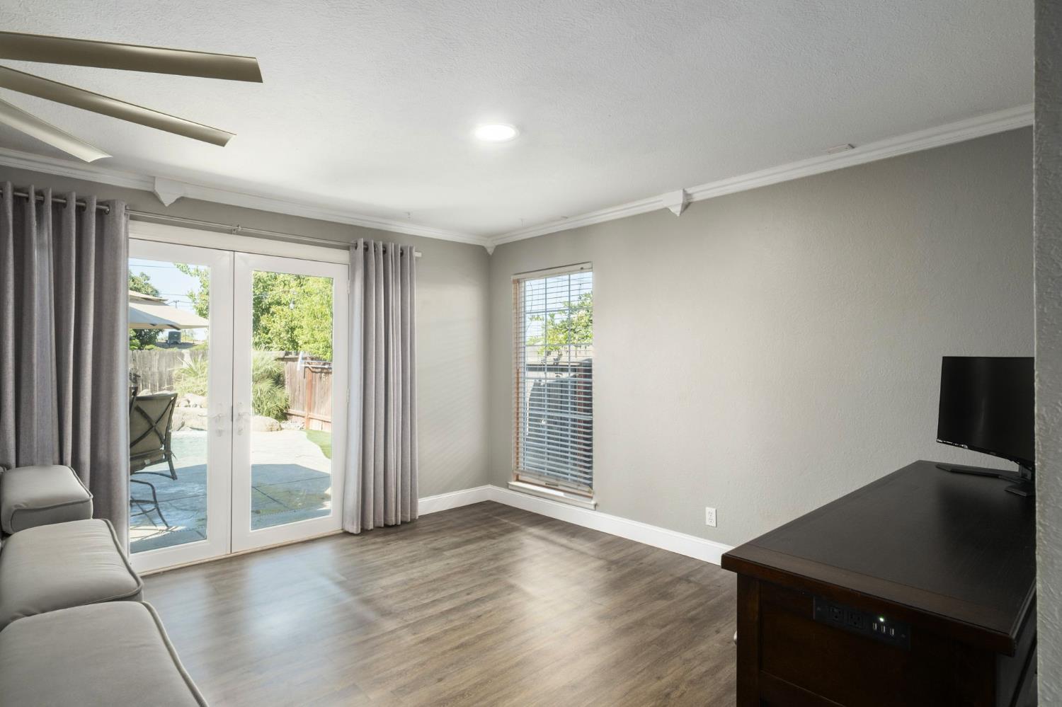2604 Harvard Avenue Clovis, CA 93612 - Photo 9 of 28 a view of a livingroom with wooden floor and a window