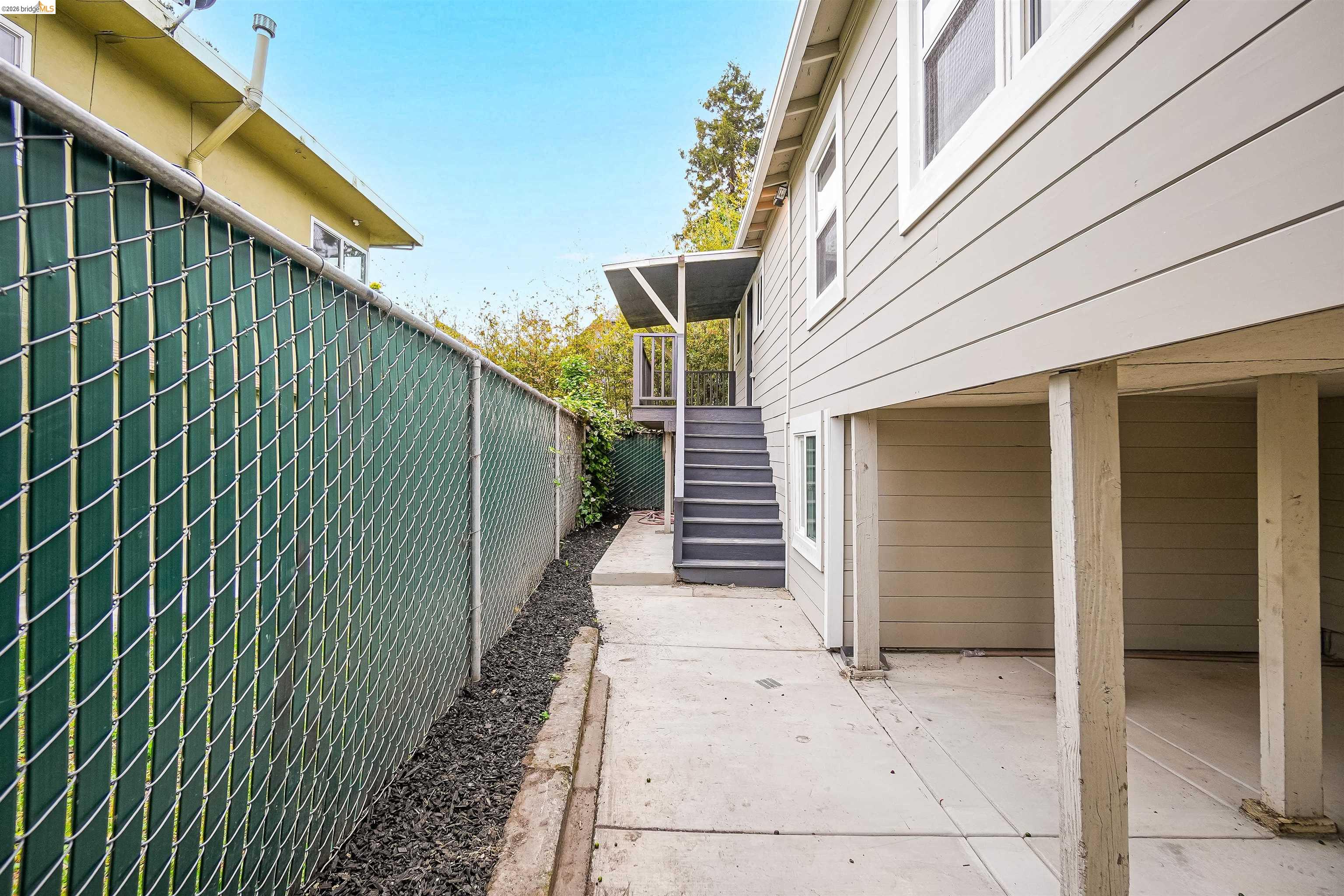 1812 Woolsey Street Berkeley, CA 94703 - Photo 27 of 48 Exterior siding with white trim around windows