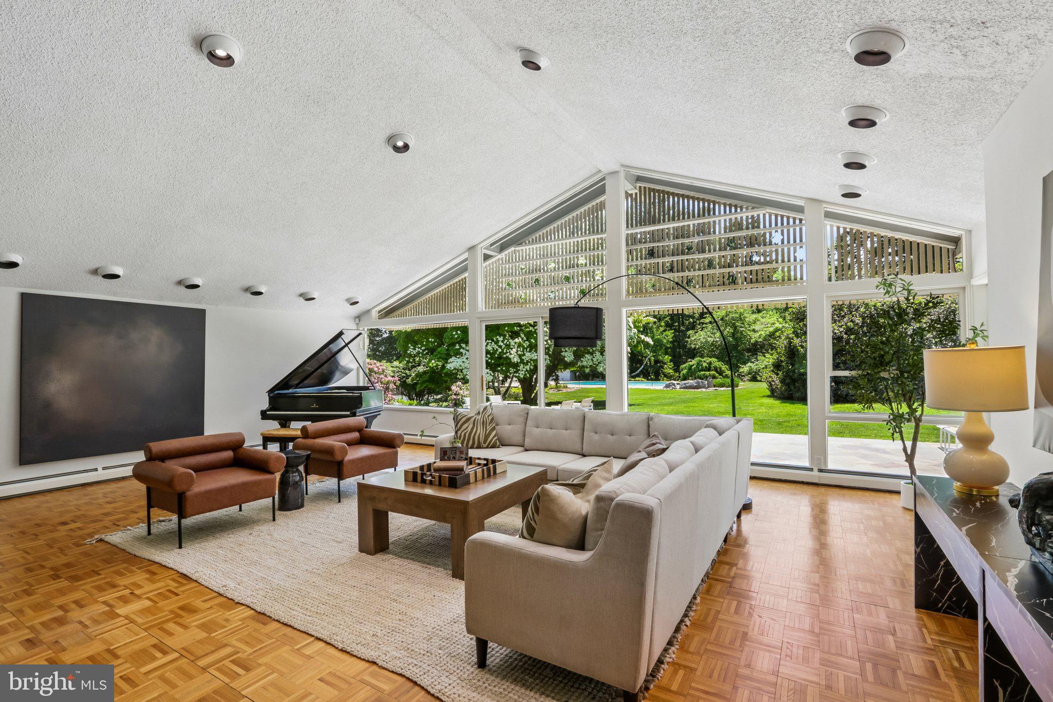 1673 Paper Mill Road Jenkintown, PA 19046 - Photo 14 of 73 a living room with furniture and a floor to ceiling window