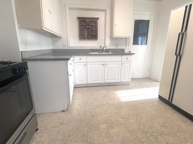 a view of a kitchen with a sink
