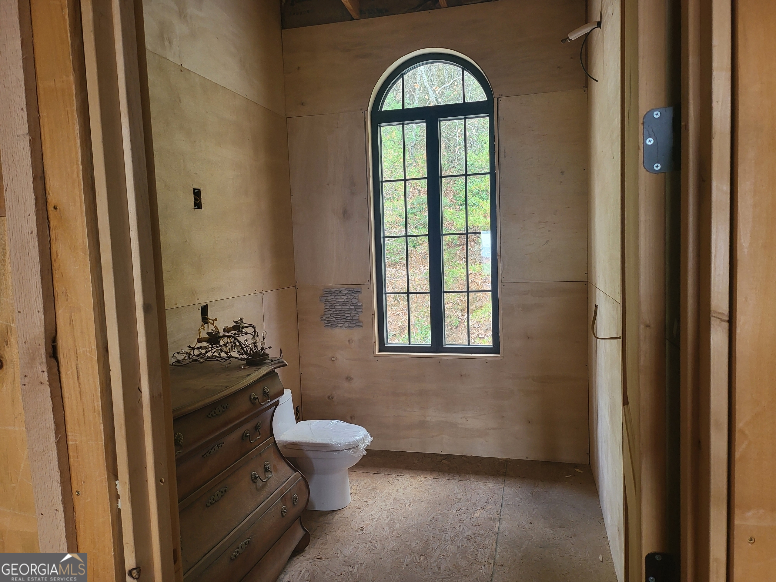 389 Fort Mountain Road Blairsville, GA 30512 - Photo 13 of 30 a bathroom with a toilet sink and mirror