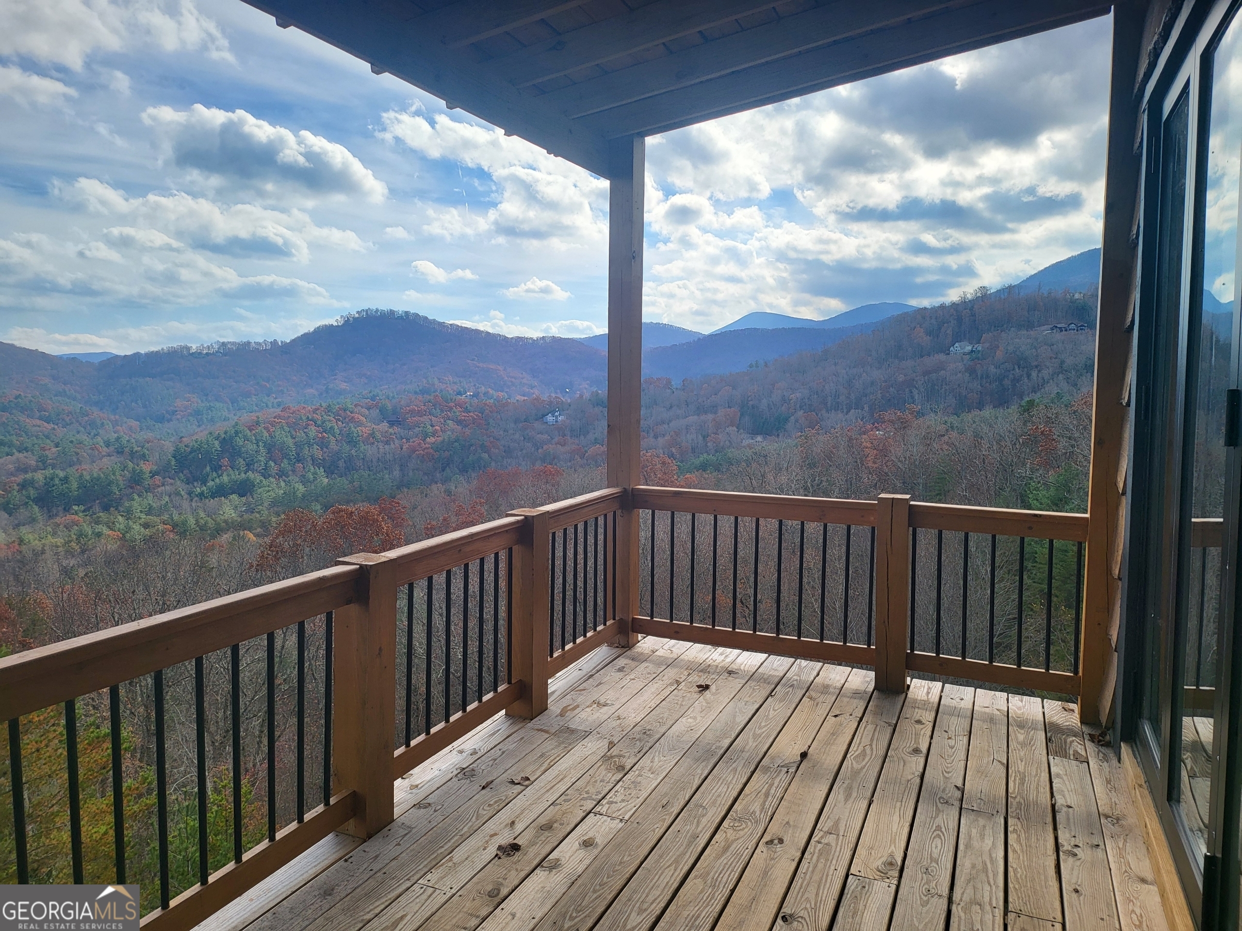 389 Fort Mountain Road Blairsville, GA 30512 - Photo 17 of 30 a view of balcony with wooden floor and fence