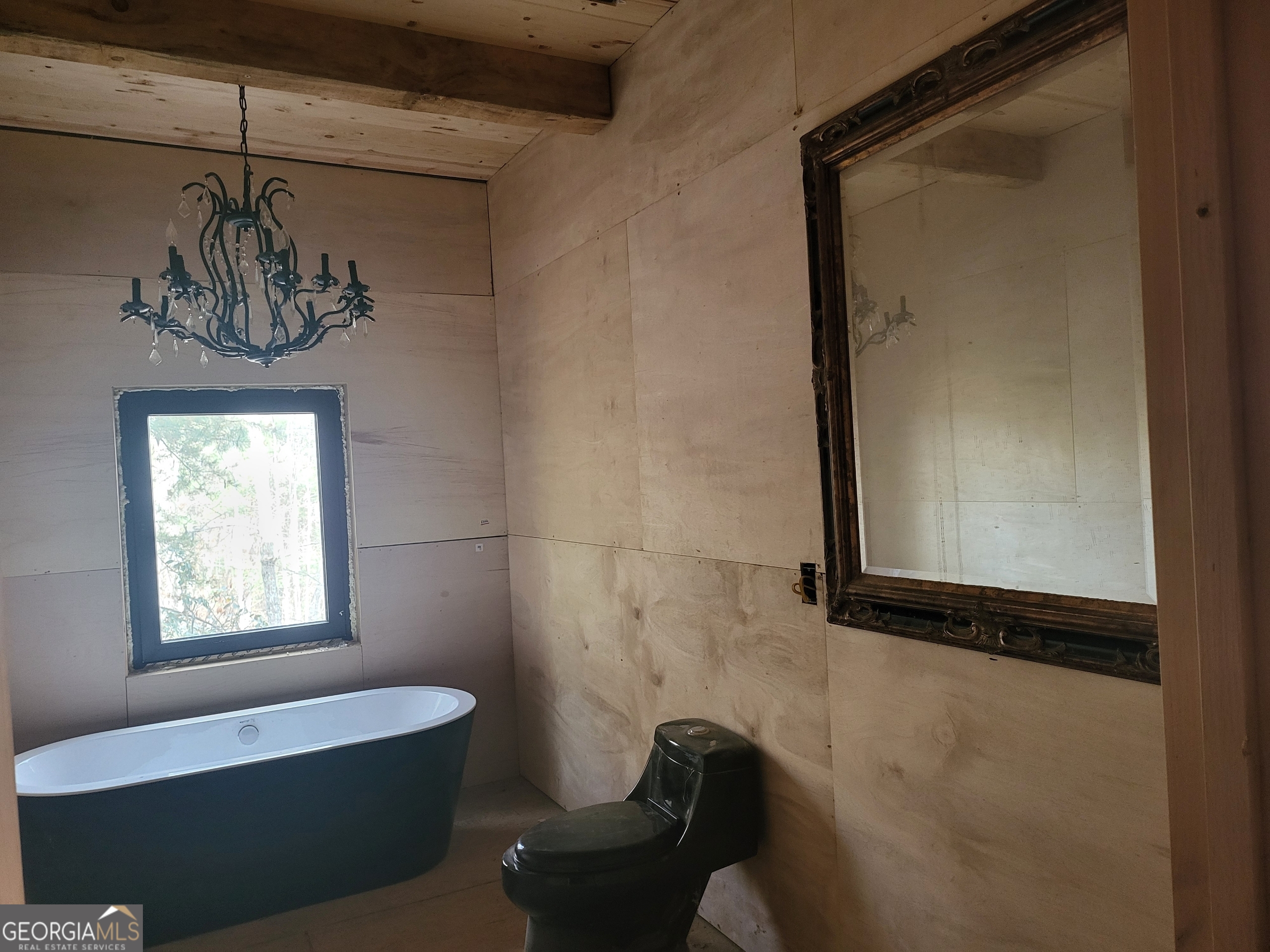 389 Fort Mountain Road Blairsville, GA 30512 - Photo 21 of 30 a bathroom with a bathtub and a shower