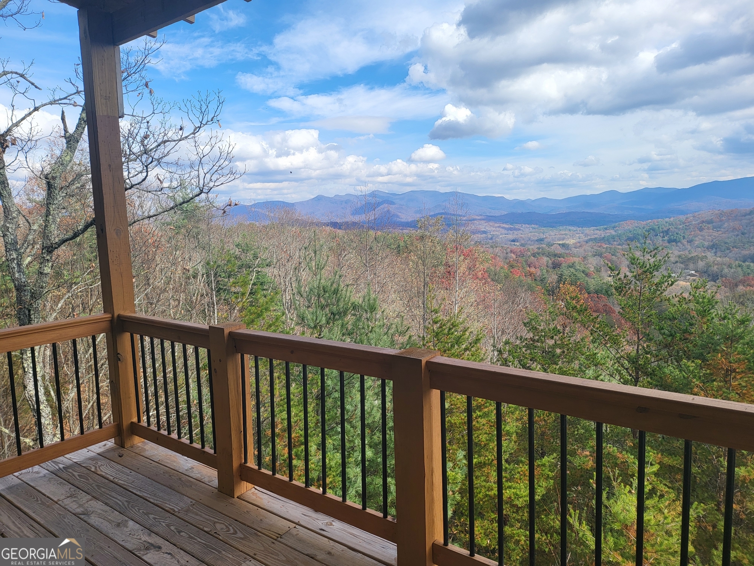 389 Fort Mountain Road Blairsville, GA 30512 - Photo 26 of 30 a view of a balcony with wooden fence and floor