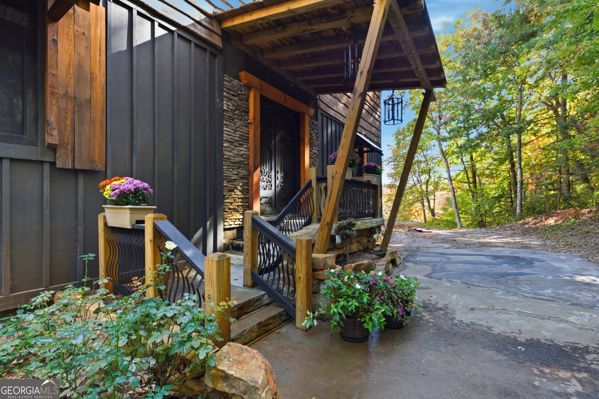389 Fort Mountain Road Blairsville, GA 30512 - Photo 4 of 30 a view of a house with a flower garden