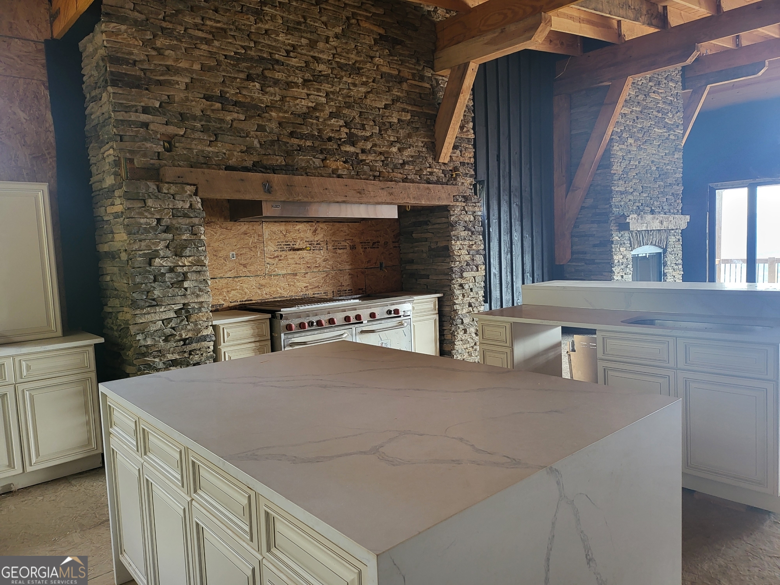 389 Fort Mountain Road Blairsville, GA 30512 - Photo 10 of 30 a kitchen with a sink and a stove top oven