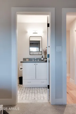 a bathroom with a sink and a mirror