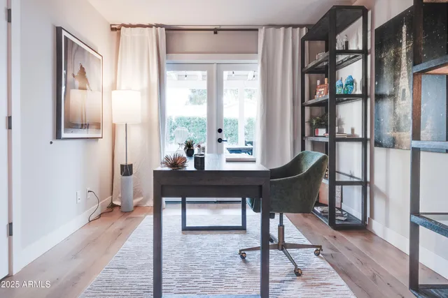 a living room with furniture a rug and a window