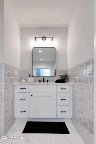 a view of a double vanity sink and a mirror