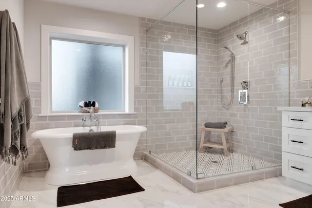 a bathroom with a shower a mirror and a sink