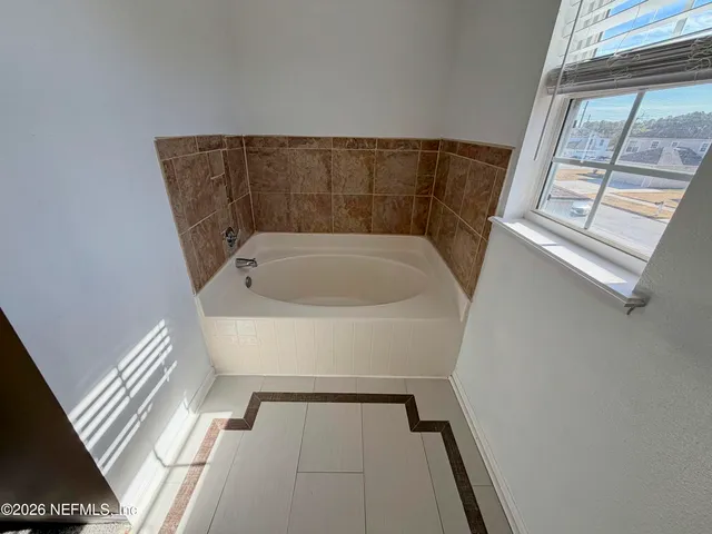 a bathroom with a bathtub
