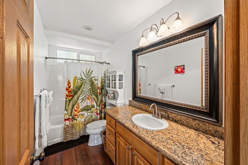 1444 West Kuiaha Road Haiku, HI 96708 - Photo 14 of 30 a bathroom with a granite countertop sink and a mirror