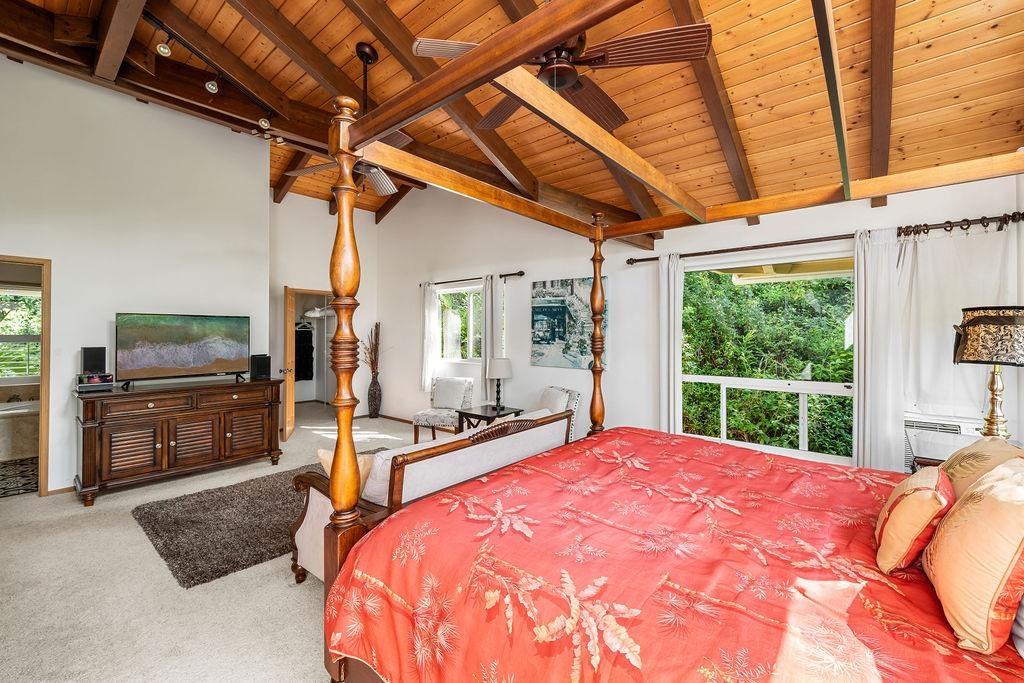 1444 West Kuiaha Road Haiku, HI 96708 - Photo 5 of 30 a bed sitting in a spacious bedroom next to a window