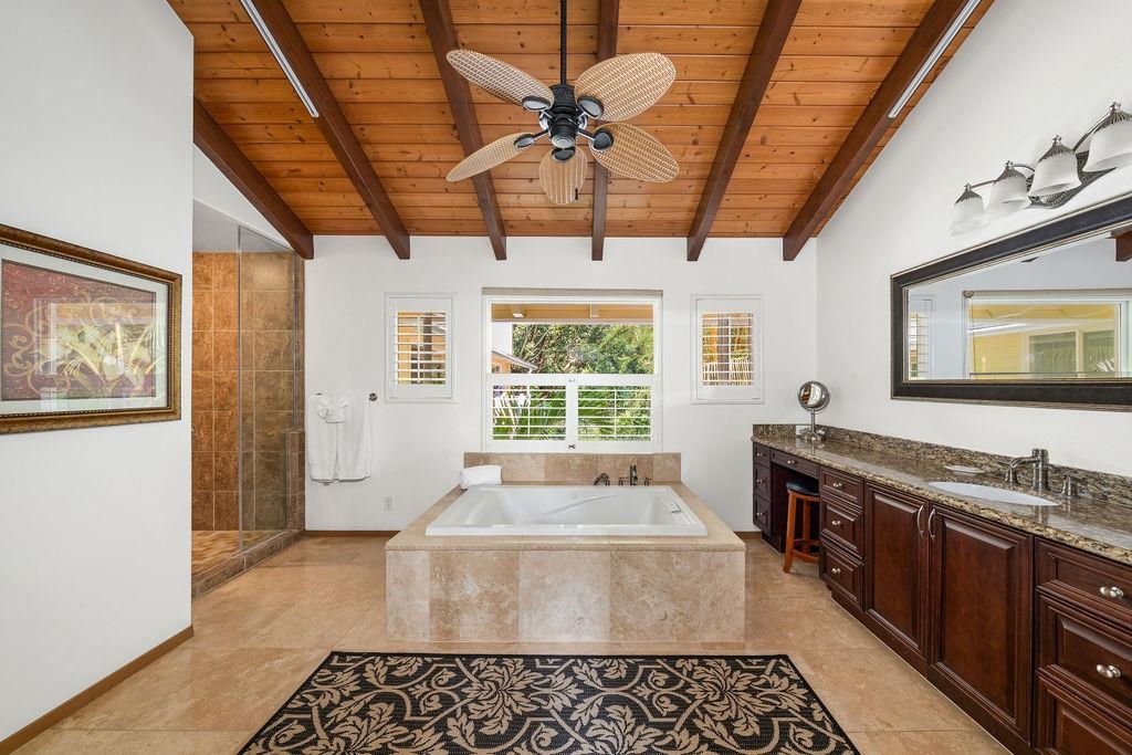 1444 West Kuiaha Road Haiku, HI 96708 - Photo 6 of 30 a spacious bathroom with a granite countertop tub sink and mirror
