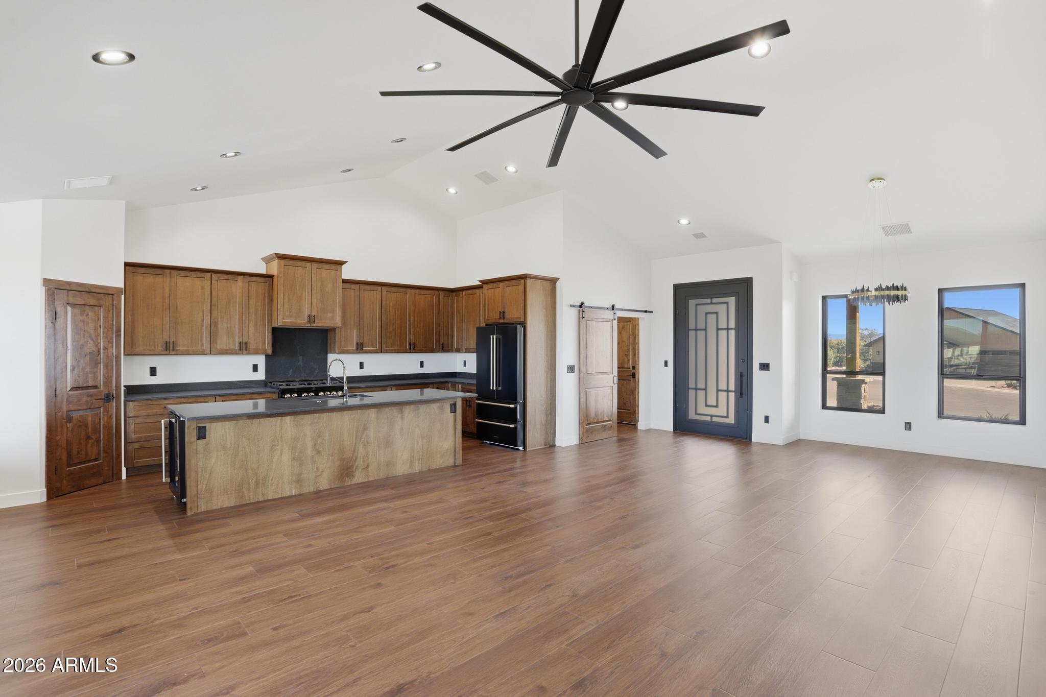 1112 South Kinzer Court Payson, AZ 85541 - Photo 12 of 41 a kitchen with stainless steel appliances kitchen island hardwood floor and a sink