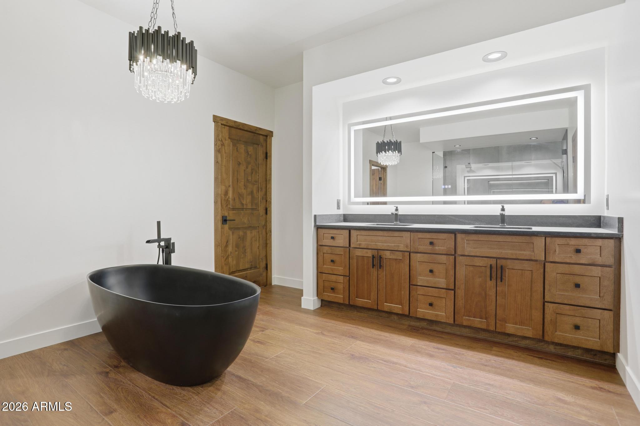 1112 South Kinzer Court Payson, AZ 85541 - Photo 21 of 41 a spacious bathroom with a granite countertop sink mirror and bathtub