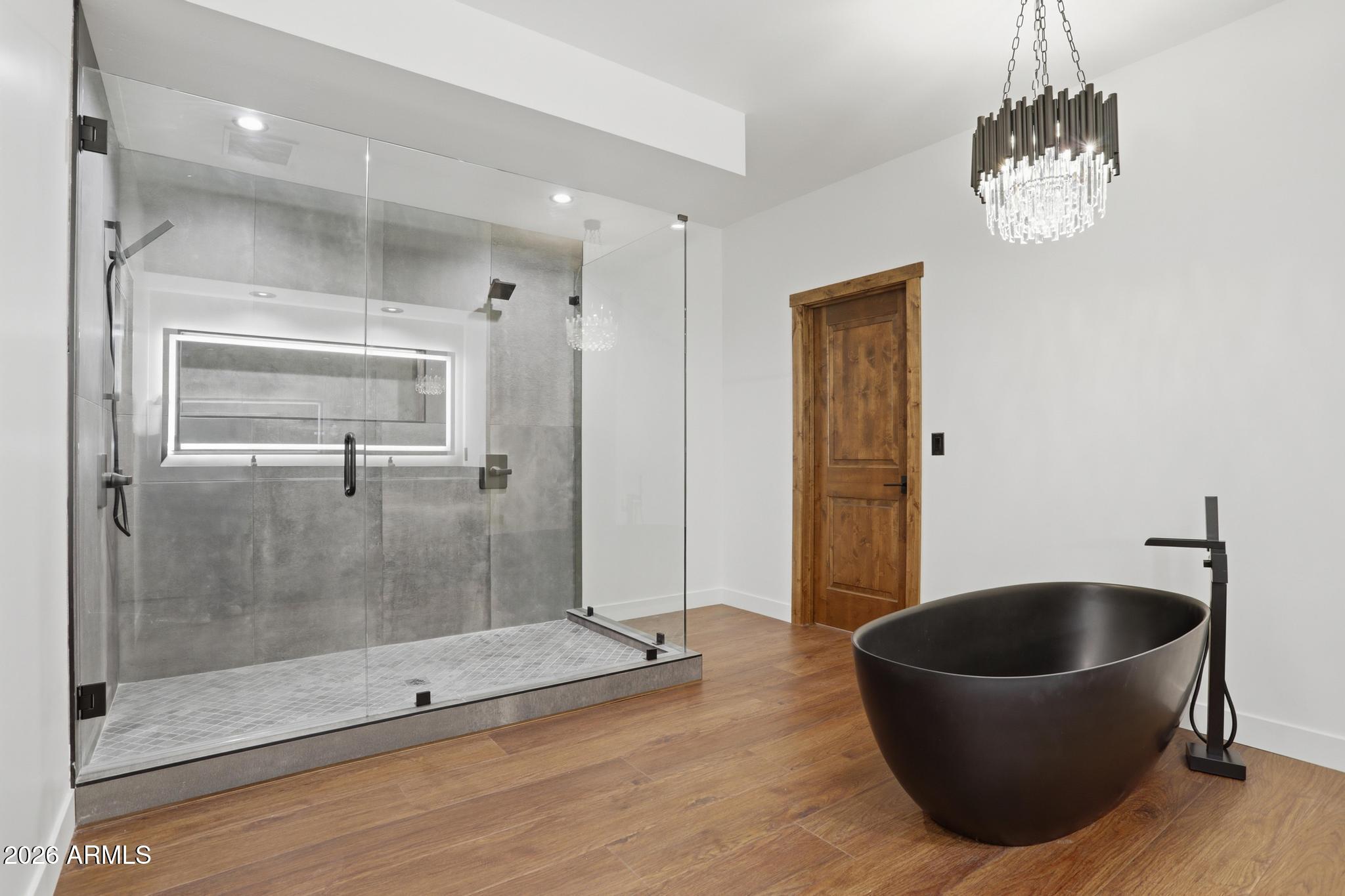 1112 South Kinzer Court Payson, AZ 85541 - Photo 5 of 41 a bathroom with a tub a mirror and shower