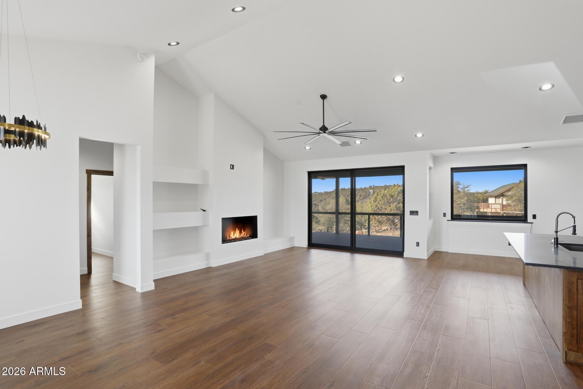 1112 South Kinzer Court Payson, AZ 85541 - Photo 6 of 41 a view of an empty room with window and wooden floor