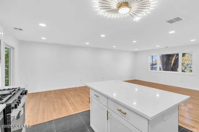 a view of room with window and ceiling fan