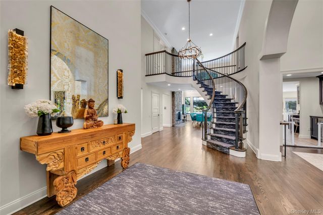 a room with lots of chairs and wooden floor