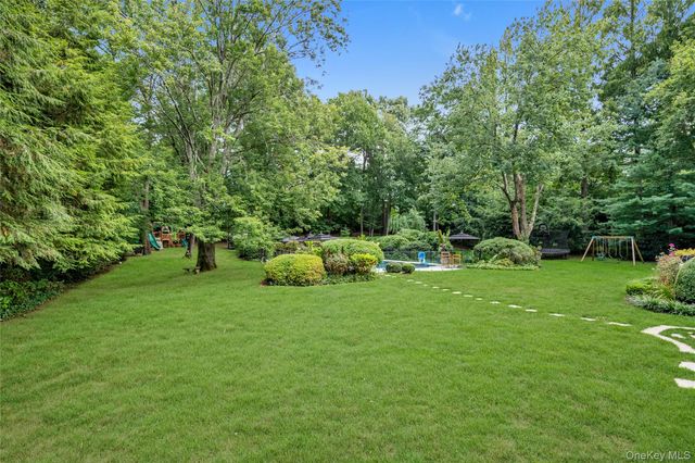 a view of a park with large trees