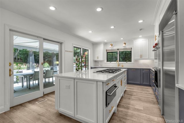 a kitchen with a stove and a sink