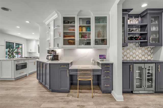 a kitchen with stainless steel appliances granite countertop a stove and cabinets