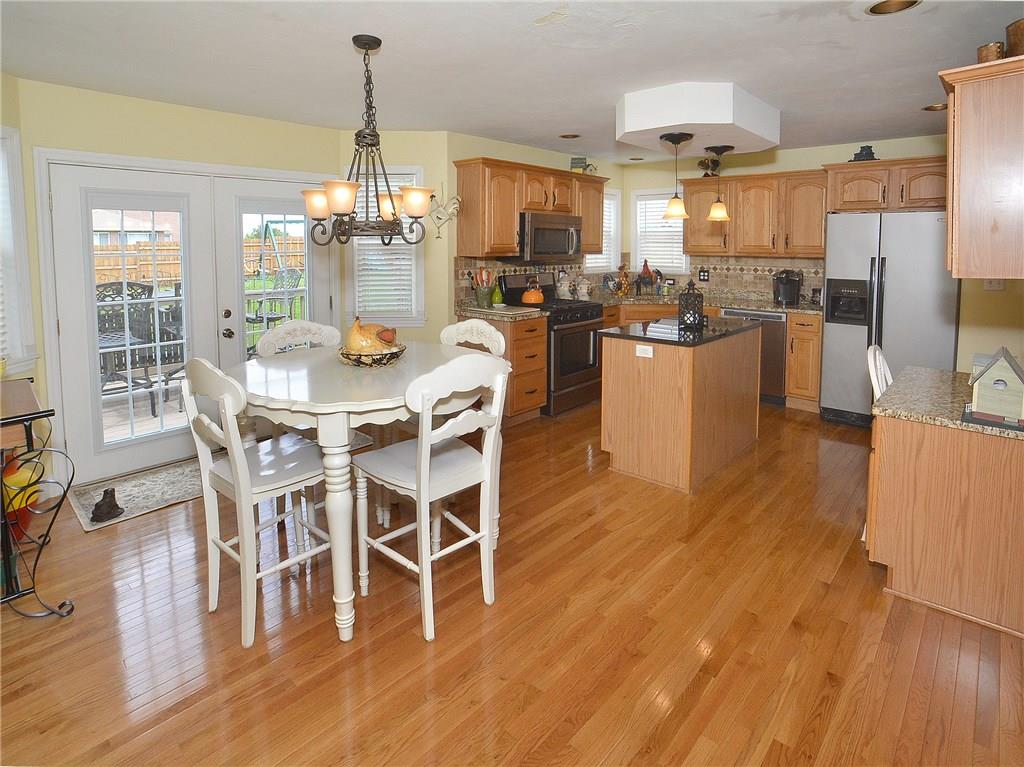 Spacious breakfast nook opens to the deck and backyard.