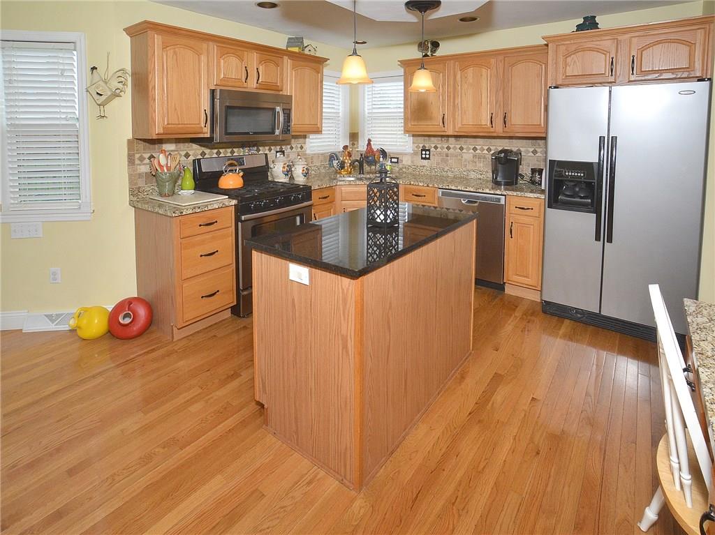 Granite counters, ceramic back splash, stainless appliances, gas stove, walk-in pantry.....wow this kitchen has it all.