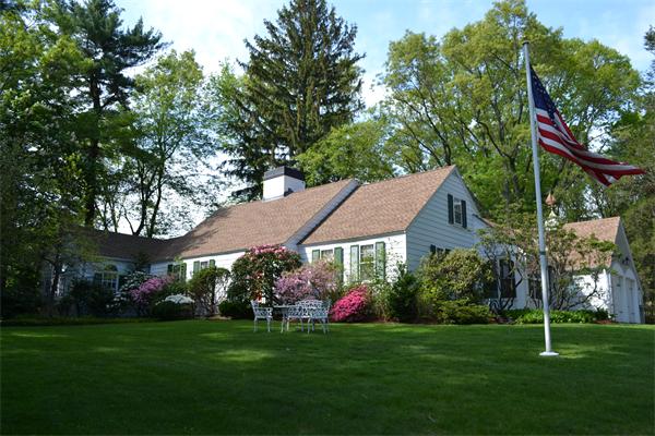 12 Oldham Road Arlington, MA 02474 - Photo 1 of 7 a view of a house with a big yard plants and large trees