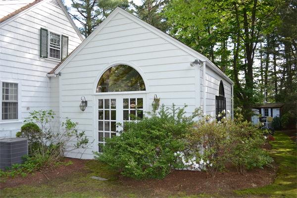 12 Oldham Road Arlington, MA 02474 - Photo 4 of 7 a view of a white house next to a yard