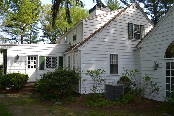 12 Oldham Road Arlington, MA 02474 - Photo 5 of 7 a view of a house with garden and plants