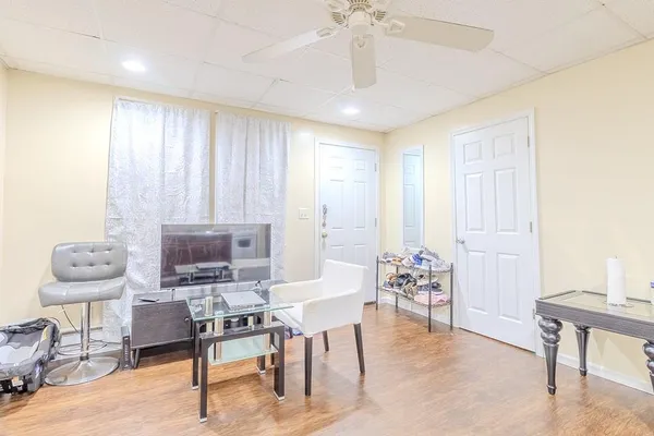 a view of a livingroom with furniture and window