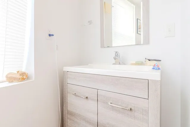 a bathroom with a sink and a vanity