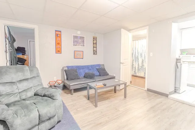 a living room with furniture and a window