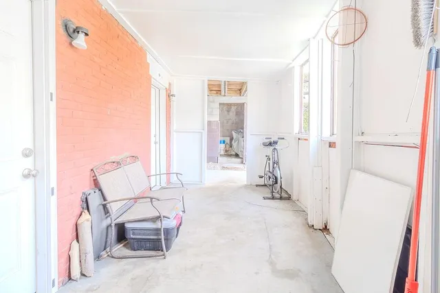 a view of a livingroom with furniture and windows