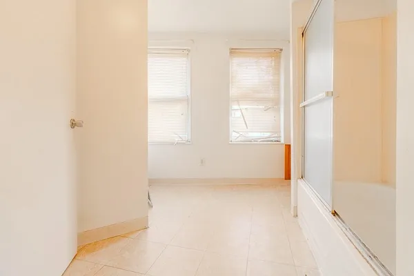 a view of an empty room with a window