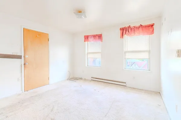 an empty room with windows