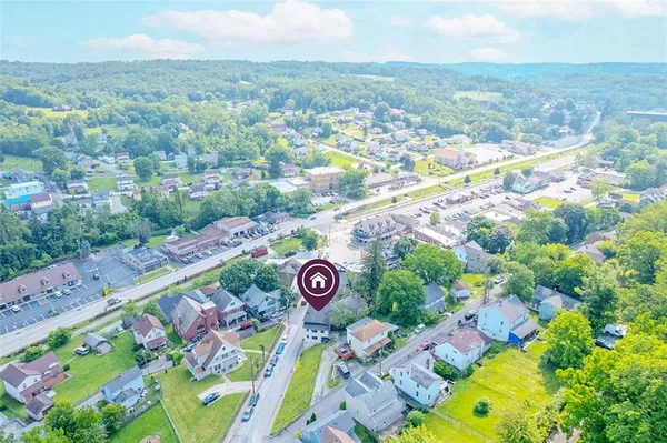 an aerial view of a street with an outdoor space