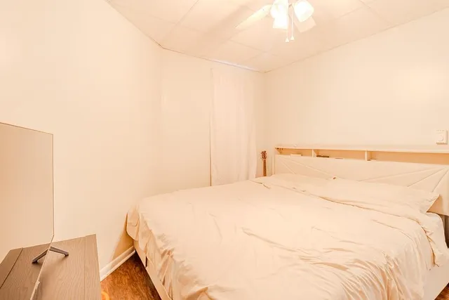 a bedroom with a bed and a cabinets