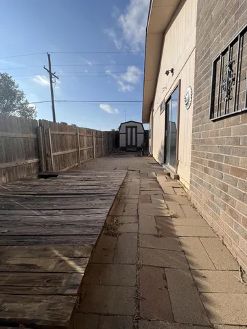 a view of a backyard of the house