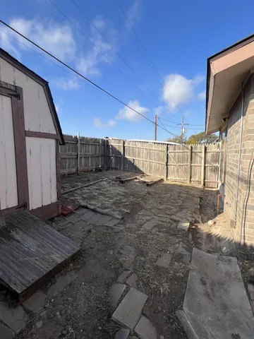 a view of a backyard of the house