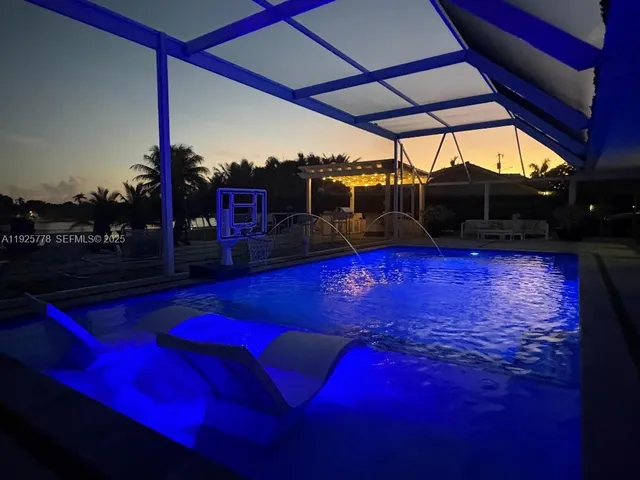 a view of swimming pool with outdoor seating