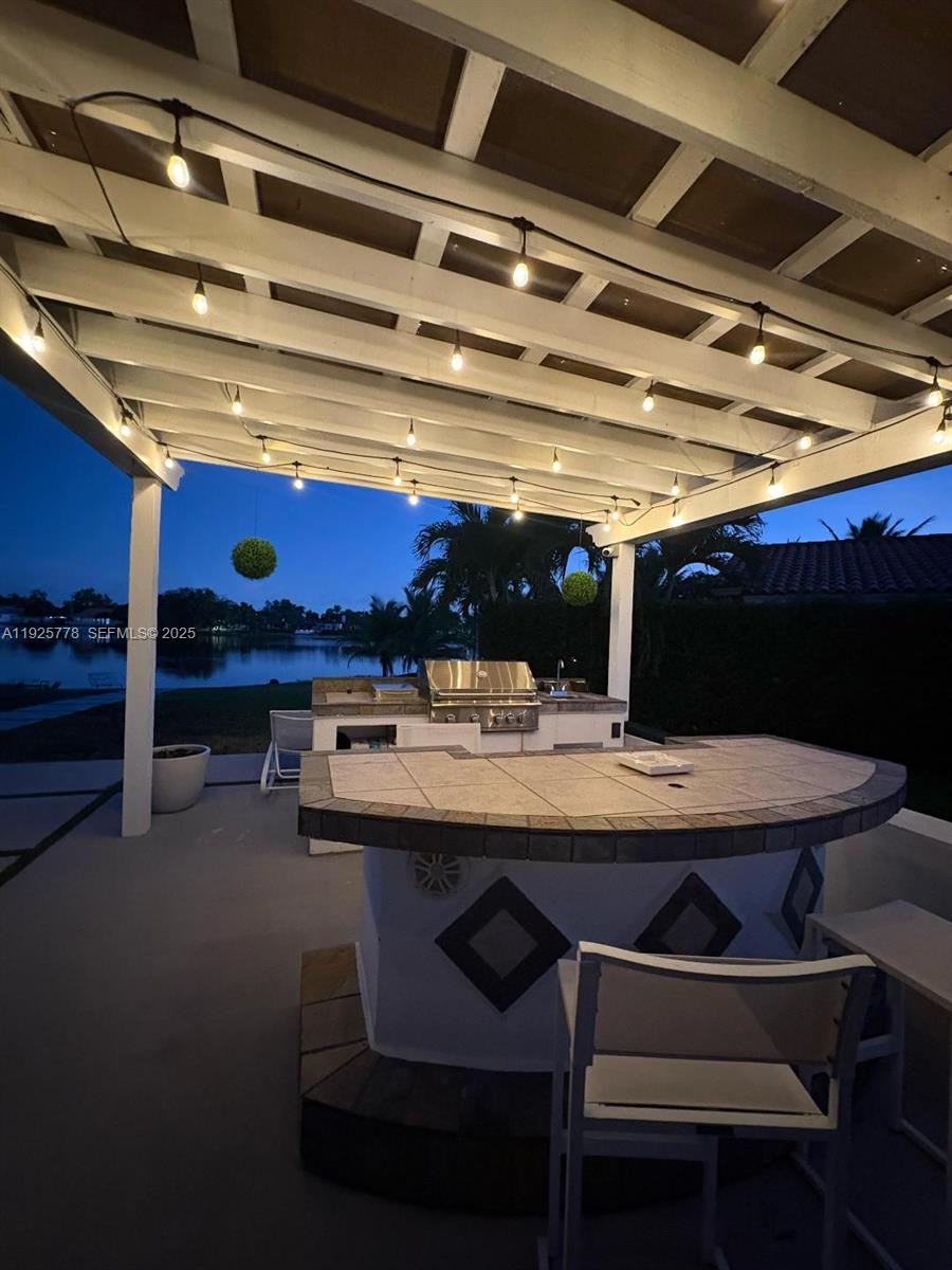 6890 Winged Foot Drive Hialeah, FL 33015 - Photo 4 of 8 a view of a kitchen with a table and chairs