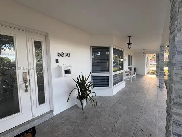 a view of livingroom with furniture and window