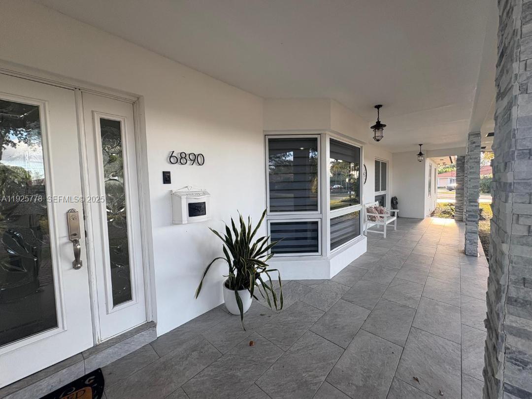 6890 Winged Foot Drive Hialeah, FL 33015 - Photo 6 of 8 a view of livingroom with furniture and window