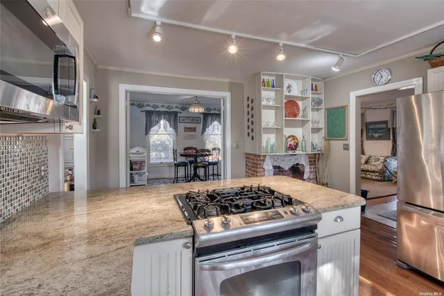 a kitchen with a stove and cabinets