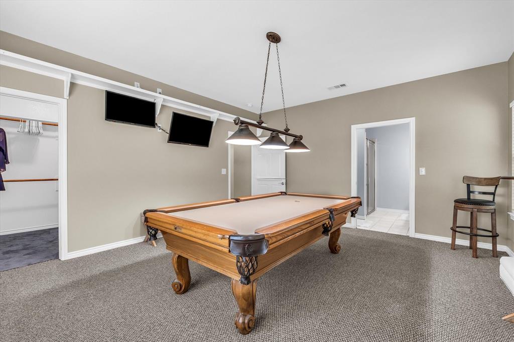 613 Bone Road Valley Mills, TX 76689 - Photo 23 of 40 a bedroom with a table and a ceiling fan