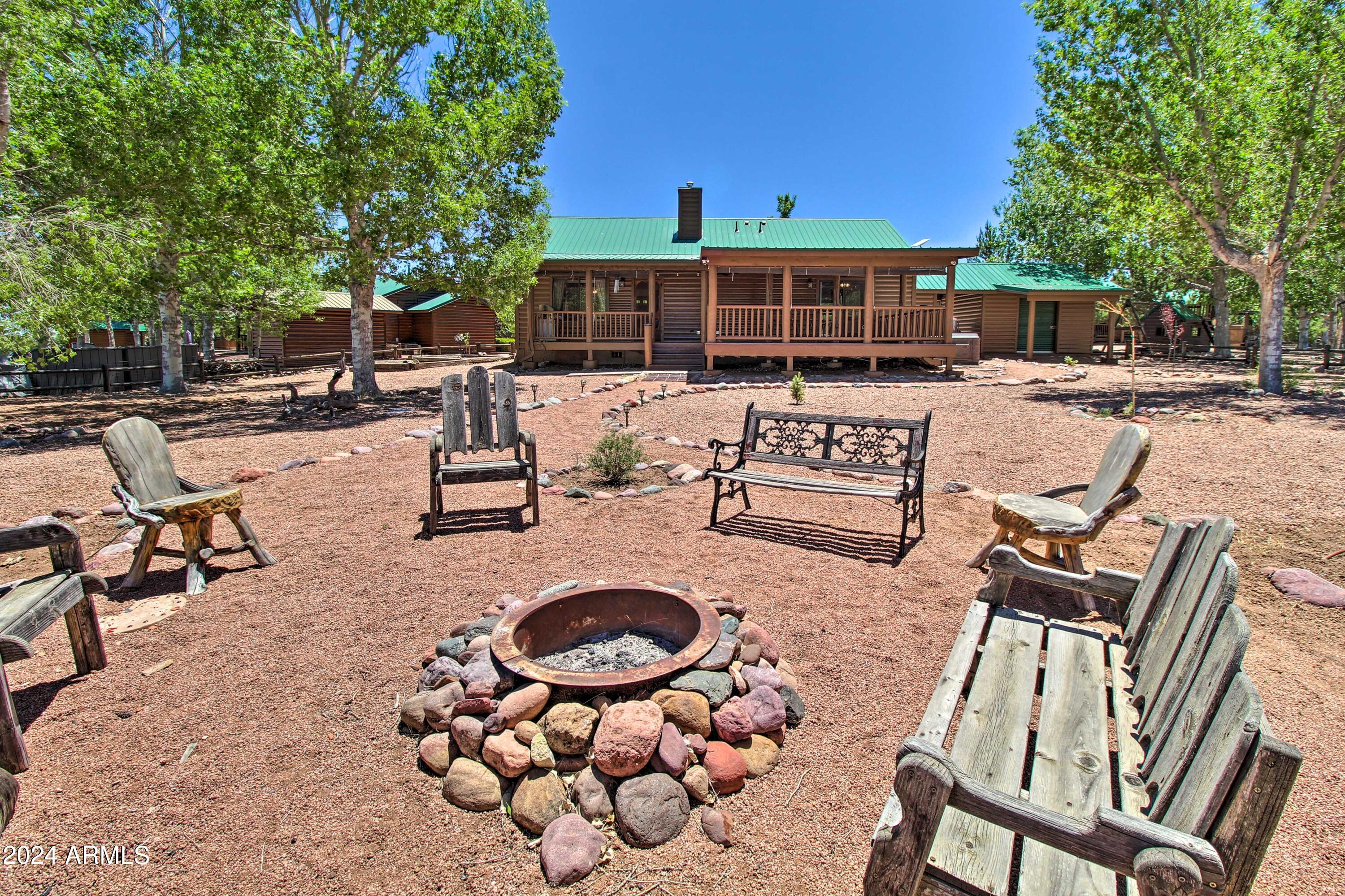 2320 Buffalo Loop Overgaard, AZ 85933 - Photo 50 of 54 BACK YARD FIRE PIT
